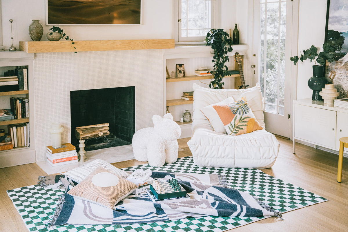 LanySpace Green Checkered Rug placed by a fireplace