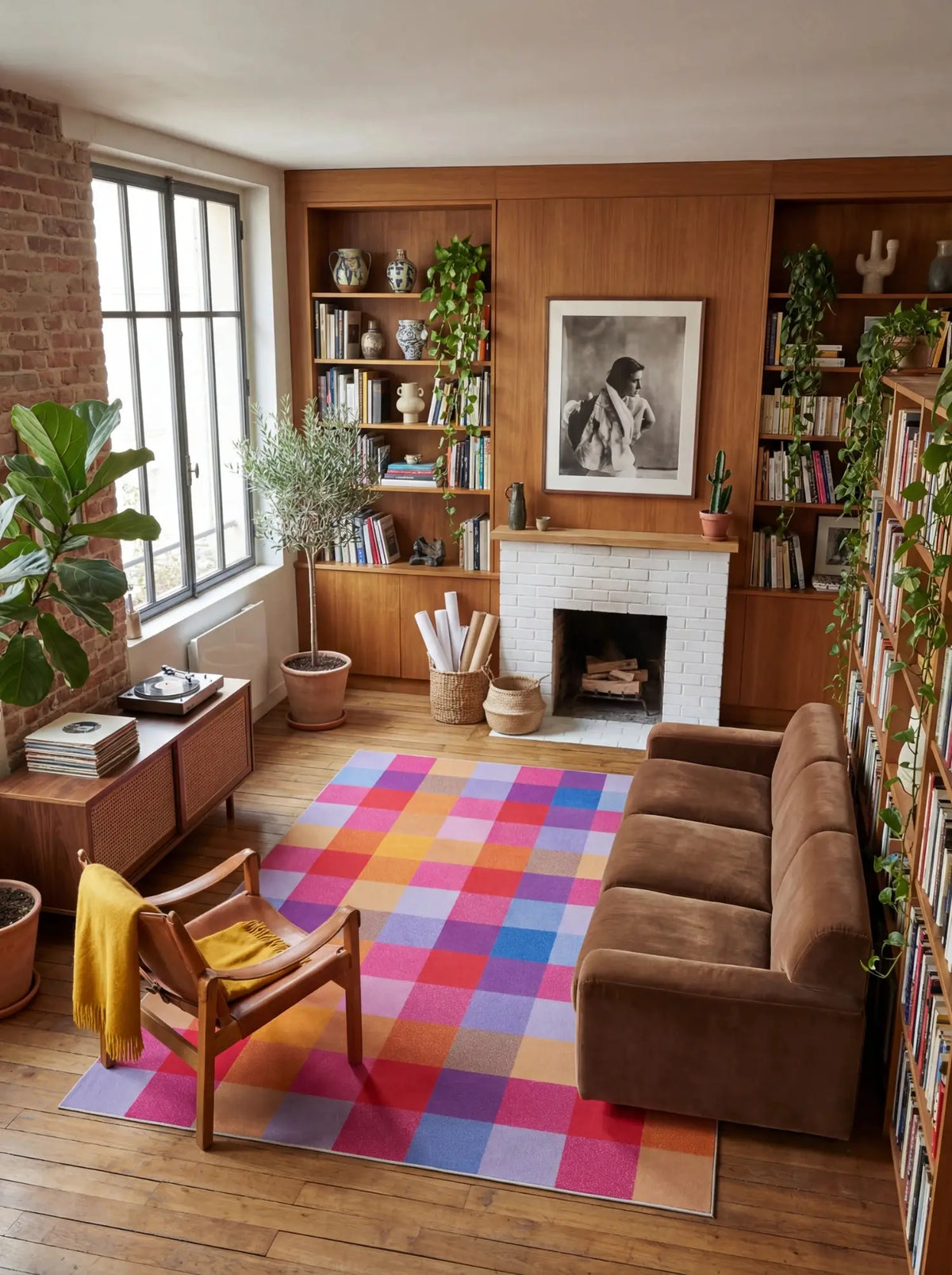 Rust Red Vintage Checkered Rug in a mid century living room with warm wood shelving and a brown sofa