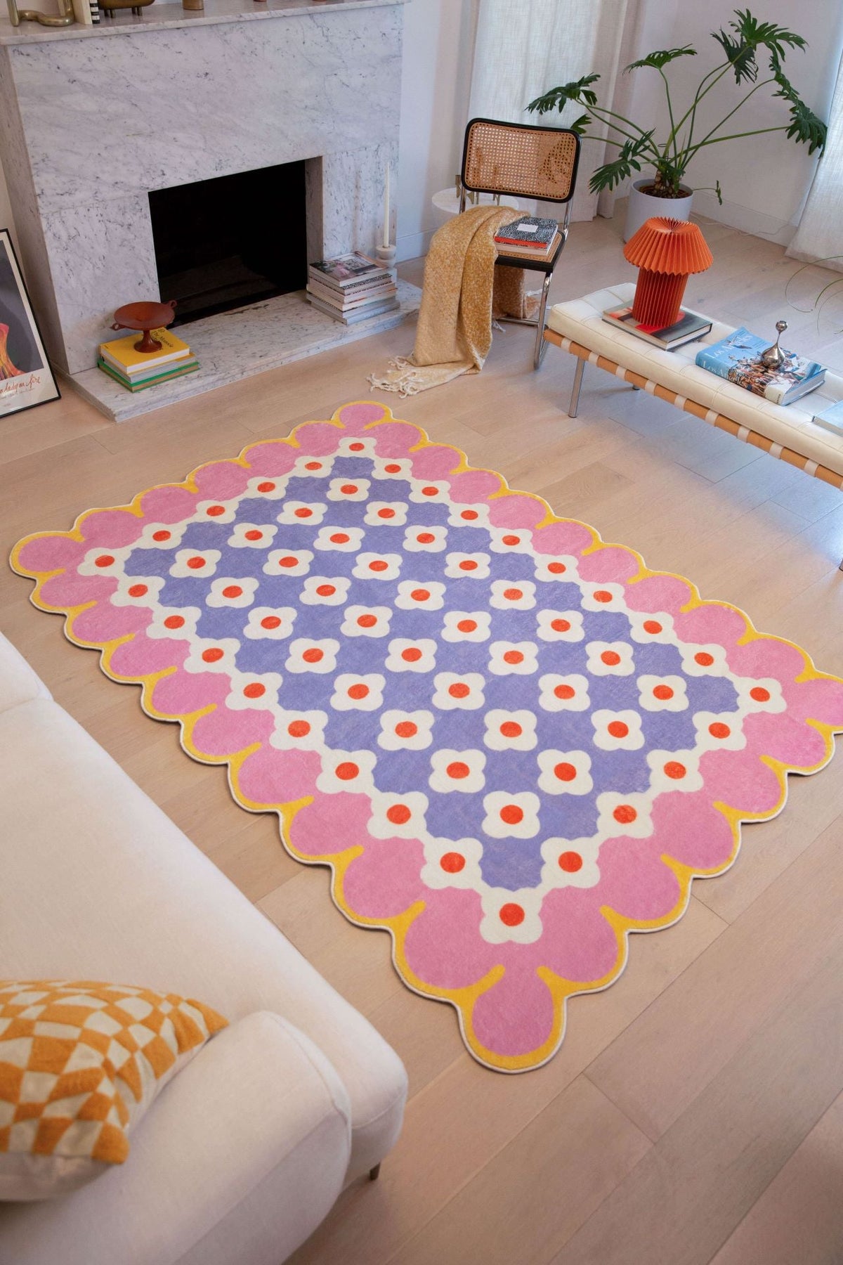 Pink and Purple Floral Area Rug displayed in a bright living room with fireplace and modern furnishings.