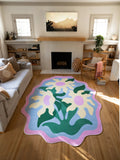 Colorful wavy flower rug centered between the sofa and fireplace on a light wood floor in a modern living room