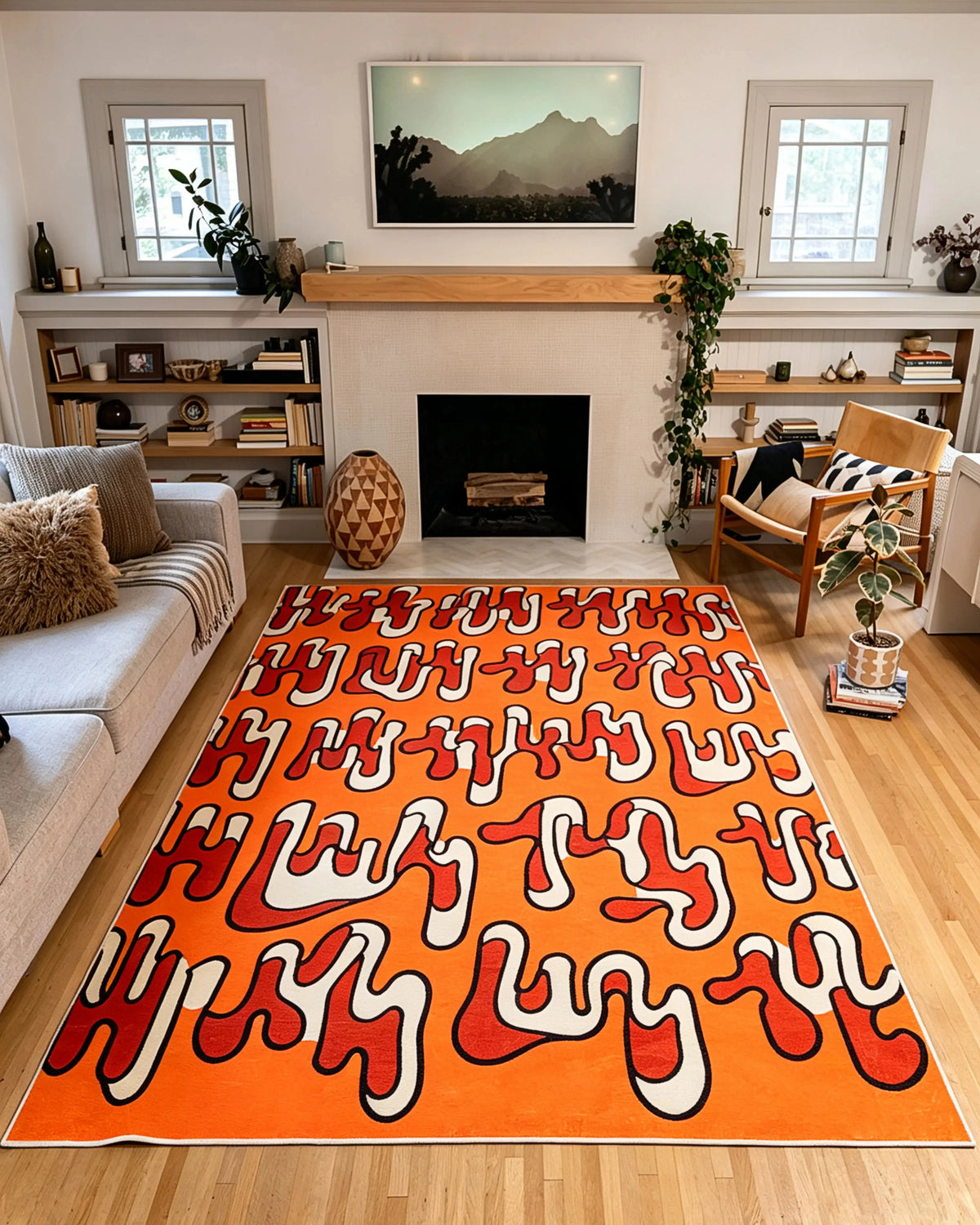 7' × 10' orange Squiggle Abstract Rug by Ariana Berman between a gray sofa and wooden armchair in a living room.