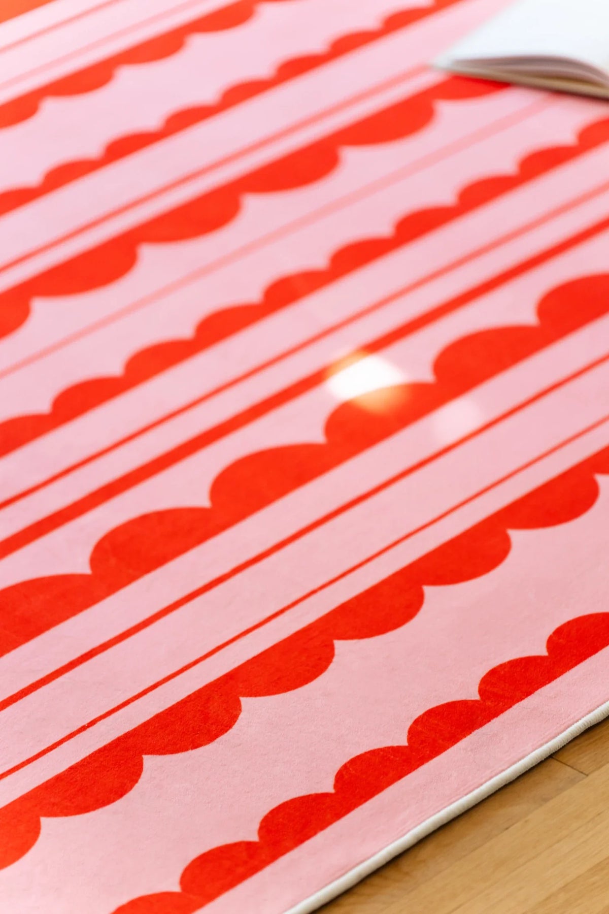 Orange and Pink Scalloped Striped Rug by Becca Franks