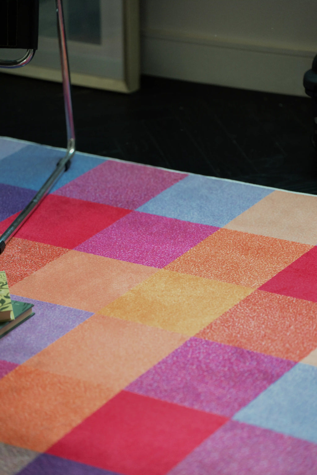 Close up of the Rust Red Vintage rug showing pink, rust red, orange, and lavender checkered blocks
