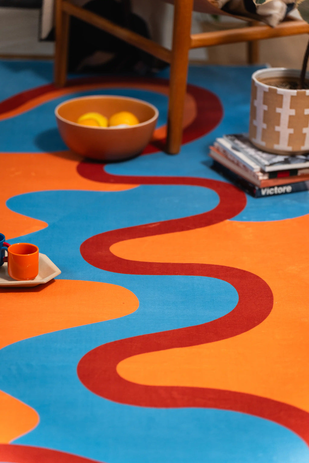 Shot from chair level, the red curve travels down the orange field as blue waves enter from both sides.