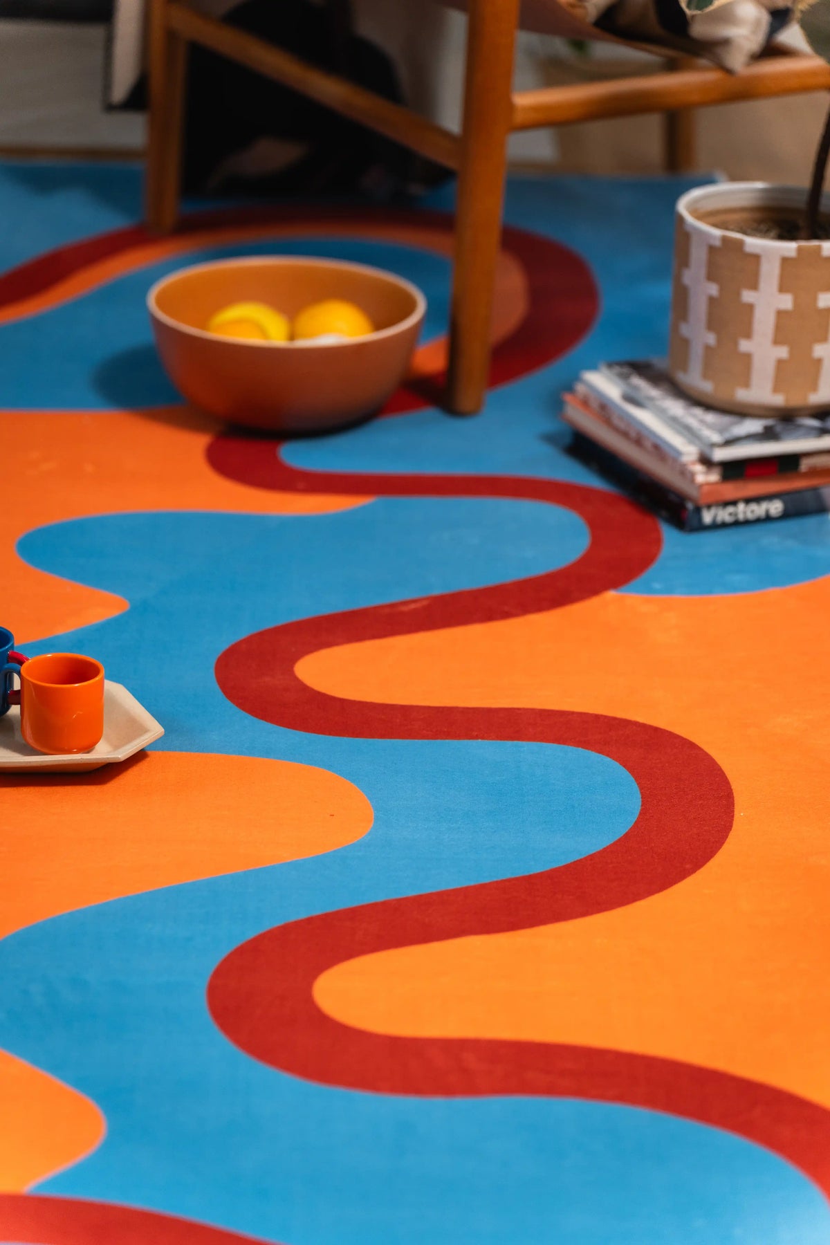 Shot from chair level, the red curve travels down the orange field as blue waves enter from both sides.
