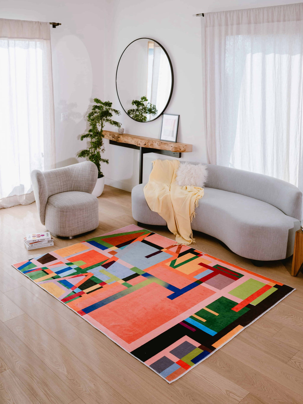 Multicolored Block Abstract Area Rug by LanySpace in a bright, modern living room with neutral furniture.