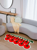 Irregular Tomato Runner Rug by Johann Banta placed in a sunlit living room, paired with a curved sofa.