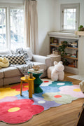 Playful interior showcasing the funky flower rug in full view, surrounded by soft neutral furniture and bright decor.