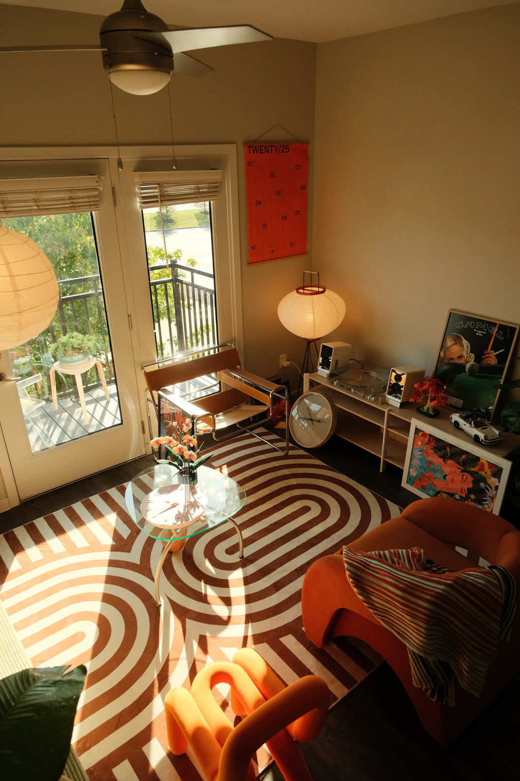 Living room styled with the curvy brown stripes design rug featuring curved brown stripes on a cream base