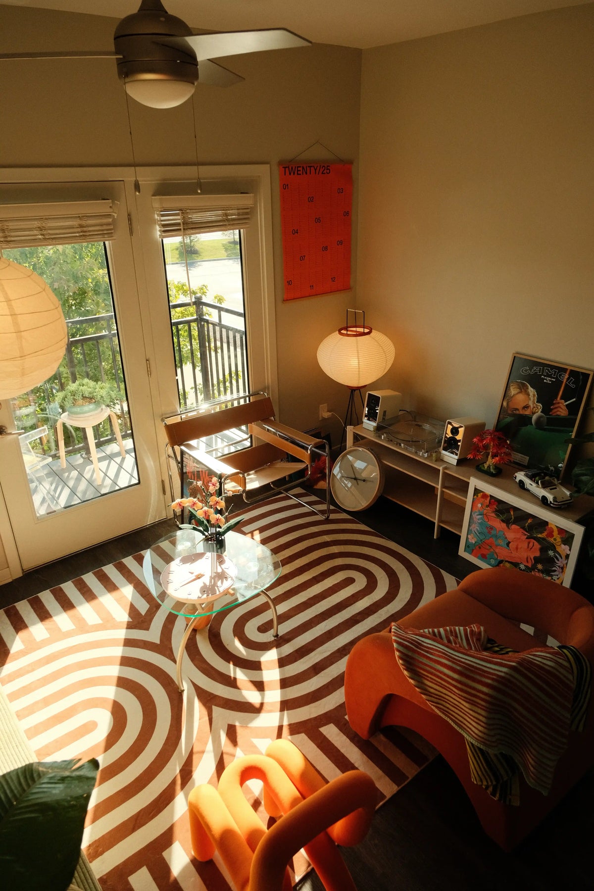 Living room styled with the curvy brown stripes design rug featuring curved brown stripes on a cream base