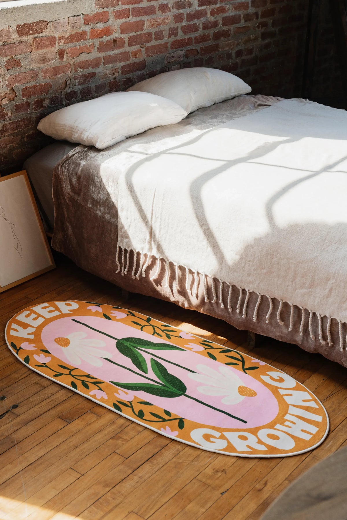 Retro Daisy Quote Rug placed on wooden floor in the bedroom corner beneath soft sunlight