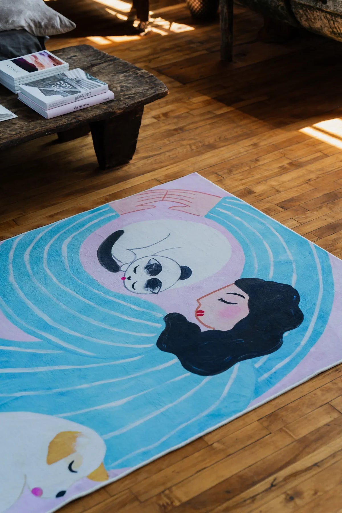 Funky Cat Lover Rug by Nimei in lilac and blue set beside a rustic wooden bench in a sunlit loft.