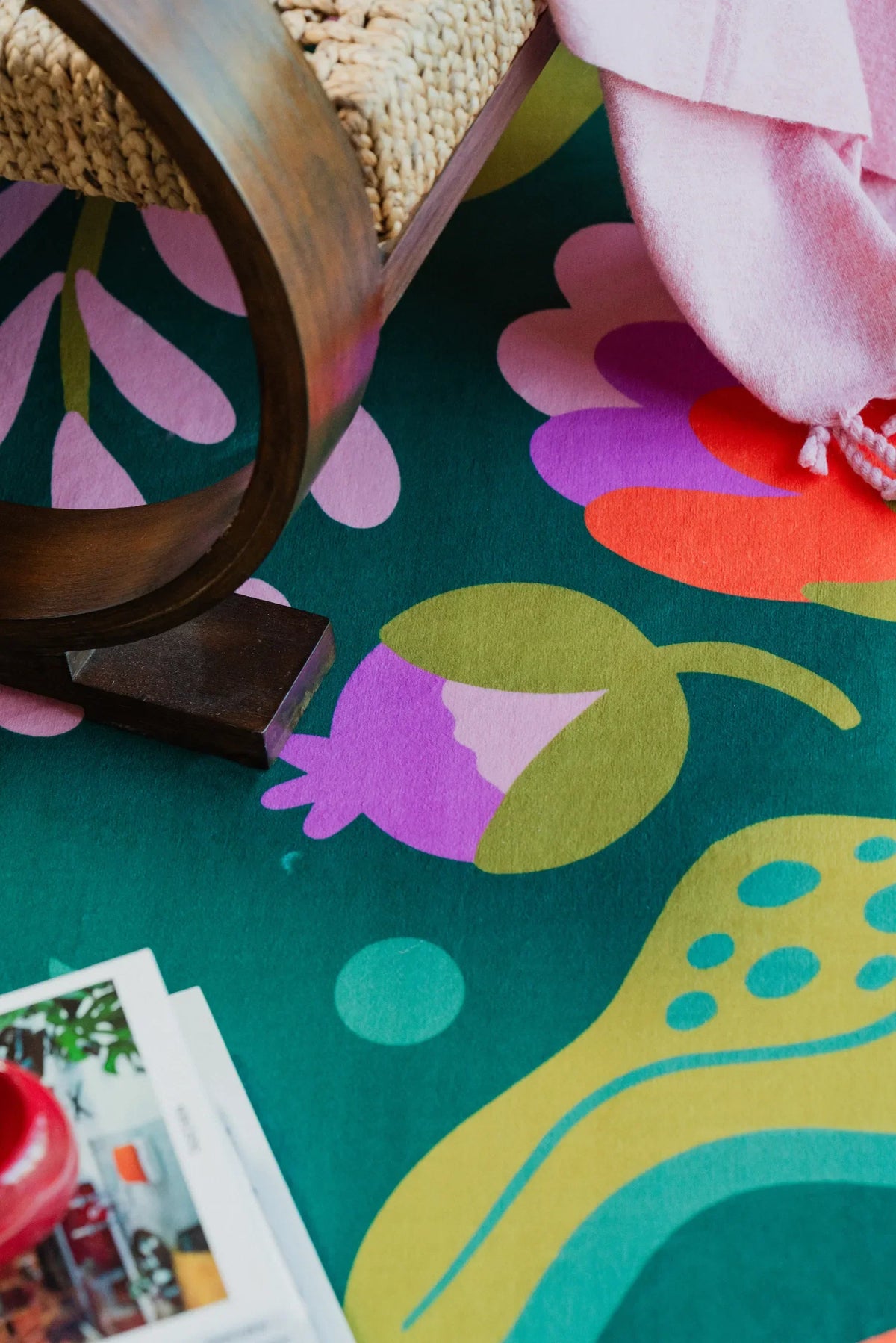 Details of the green rug with pink and purple floral accents from the latest Lany Space Designer Collection