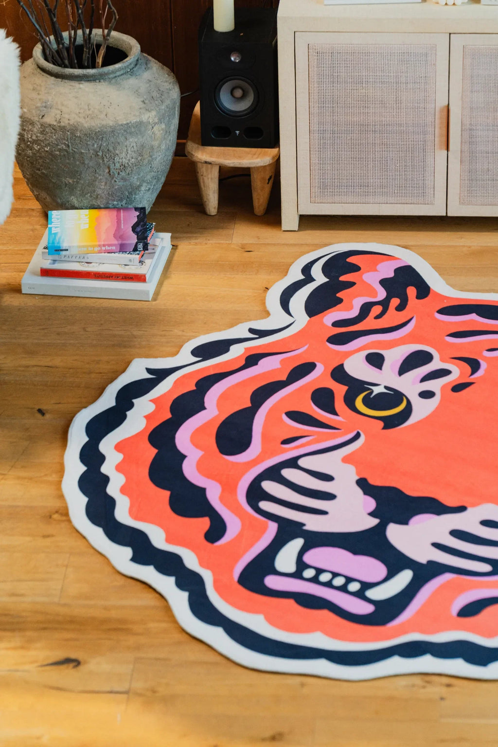 A close-up view of the Funky Statement Tiger Rug on wood floor in a bright corner setup.