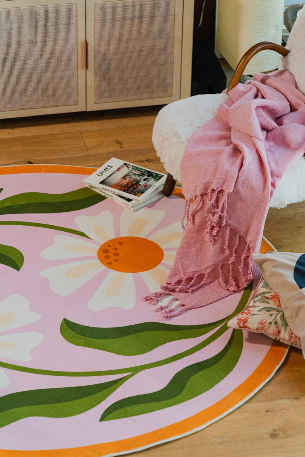 A cozy nook with the Lany Space x Jessica Miller Dual Daisy Pink Round Rug, 6' x 6'