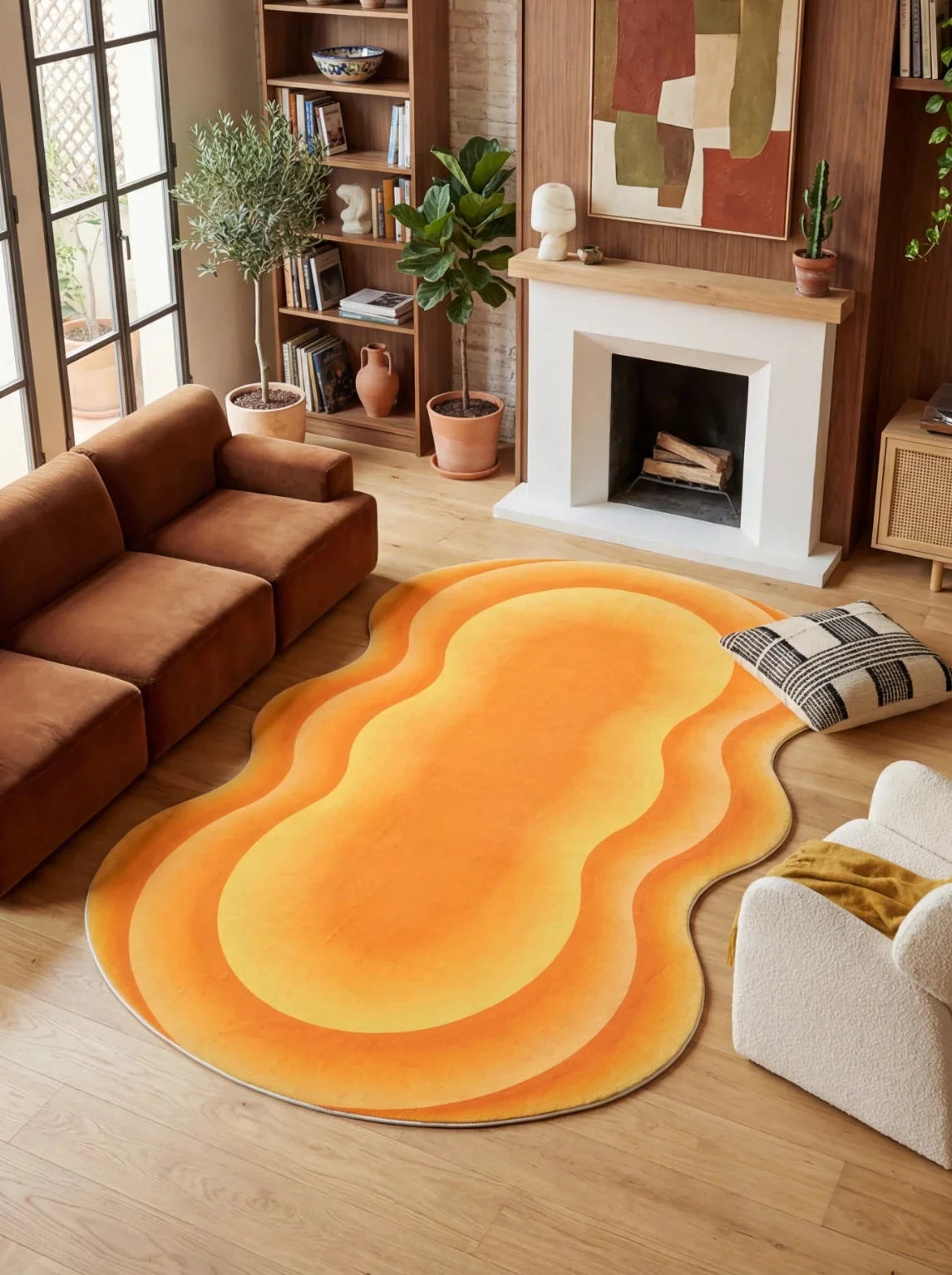 Orange Modern Abstract Wavy Area Rug by Juan Marquez in a warm living room with a brown sofa and white fireplace