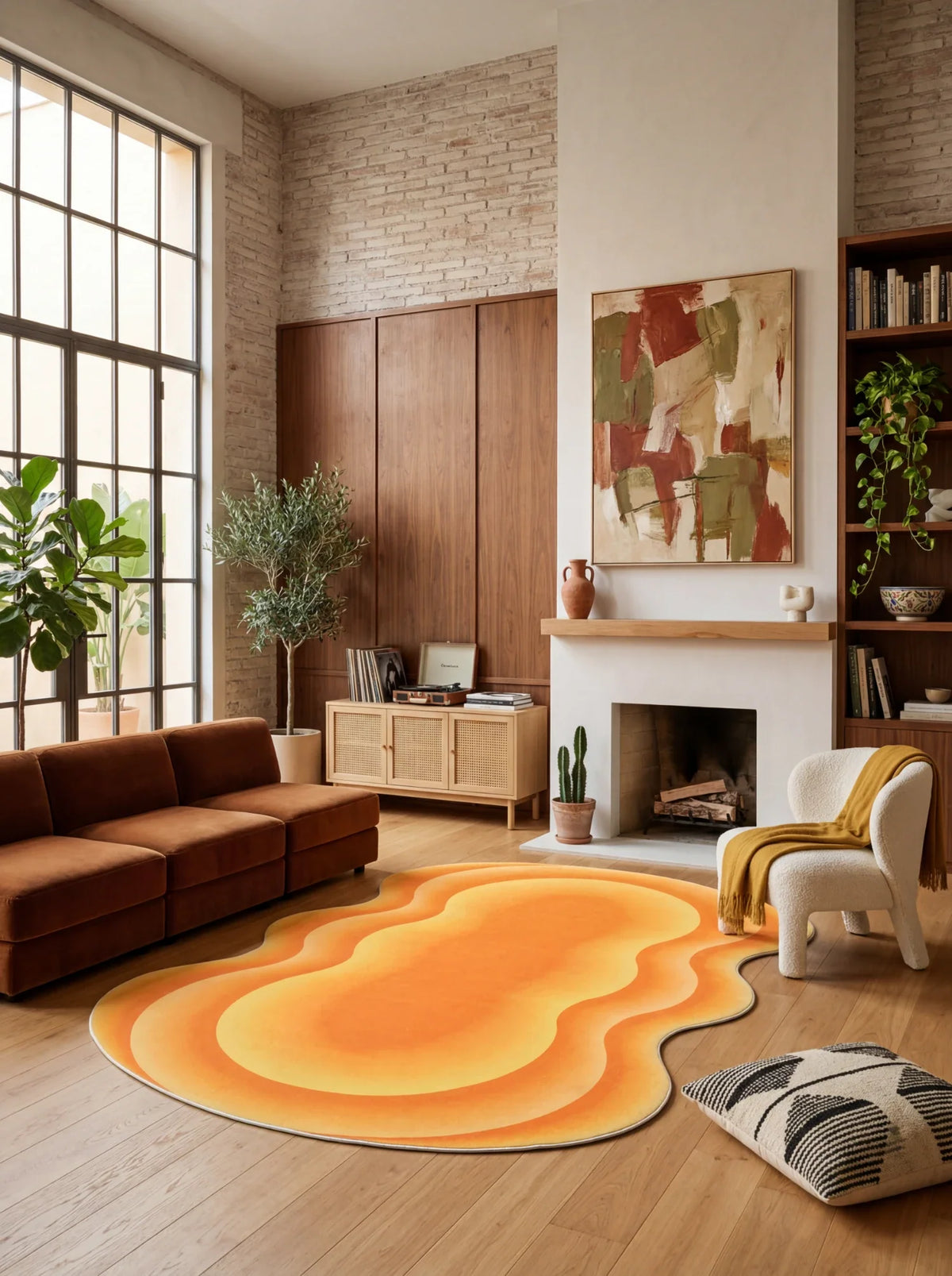 Modern orange wavy rug styled in a sunlit living room with open shelving, a white fireplace, and a brown sofa